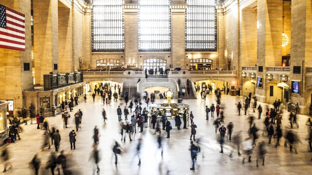 Crowded urban concourse at rush hour — a visual metaphor for the many subscription decisions every Apple household navigates.