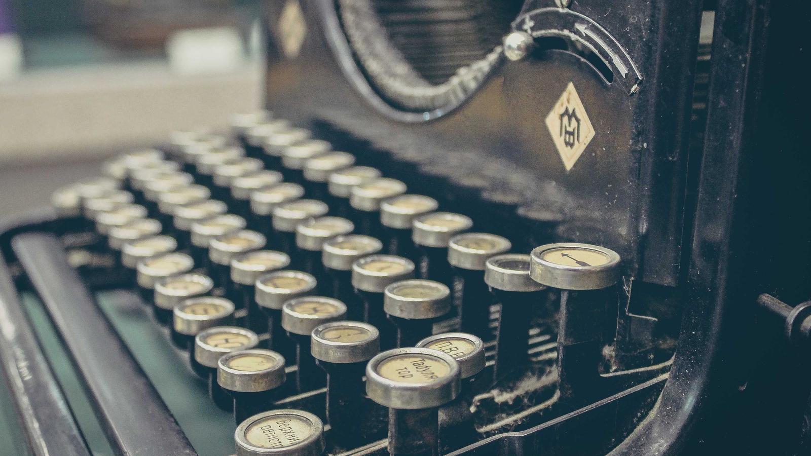 Close-up of vintage typewriter keys — a visual metaphor for the calculation work of comparing subscription bundles.